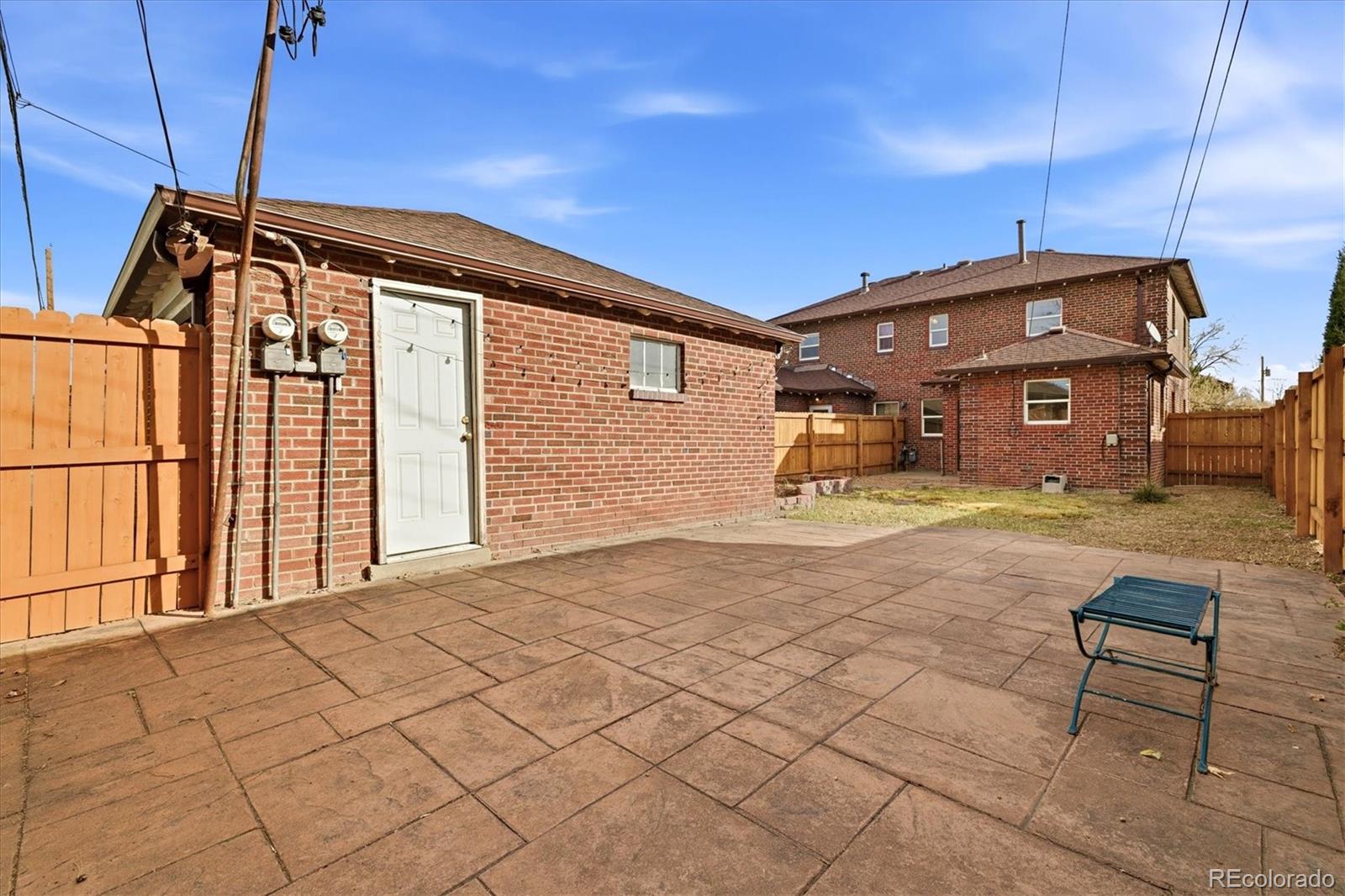 2053 Quitman Street Denver, CO 80212 - Photo 35 of 39 a front view of a house with a yard