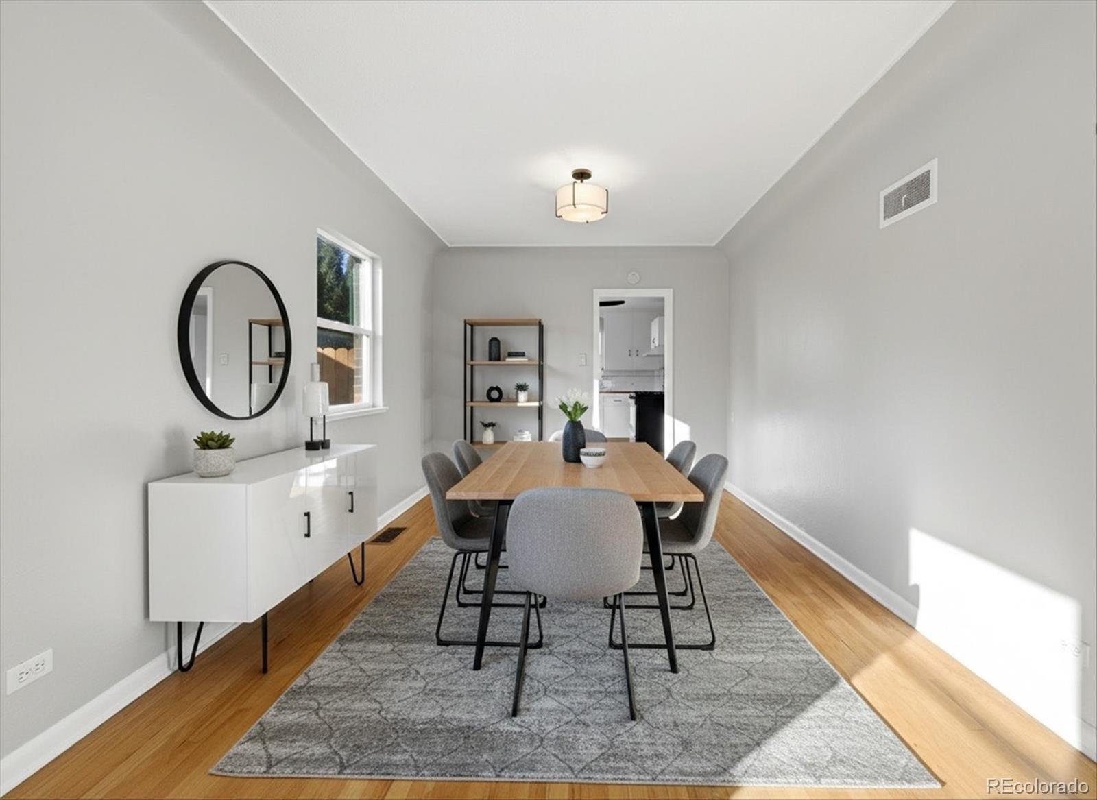 2053 Quitman Street Denver, CO 80212 - Photo 9 of 39 a view of a dining room with furniture and a rug