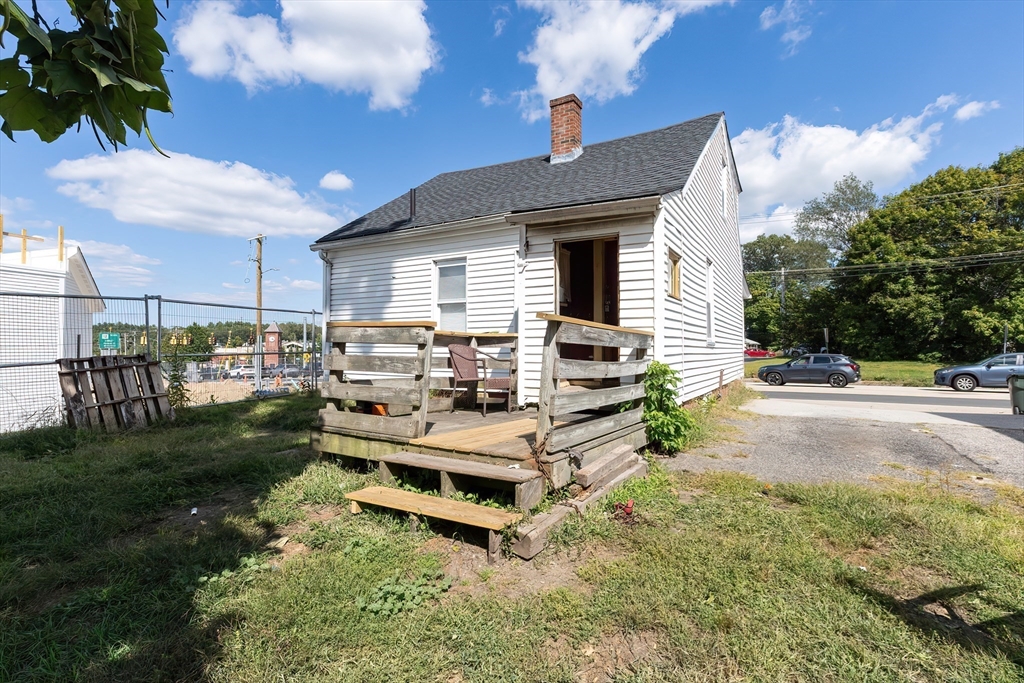 8 Thompson Road Webster, MA 01570 - Photo 20 of 24 a backyard of a house with table and chairs