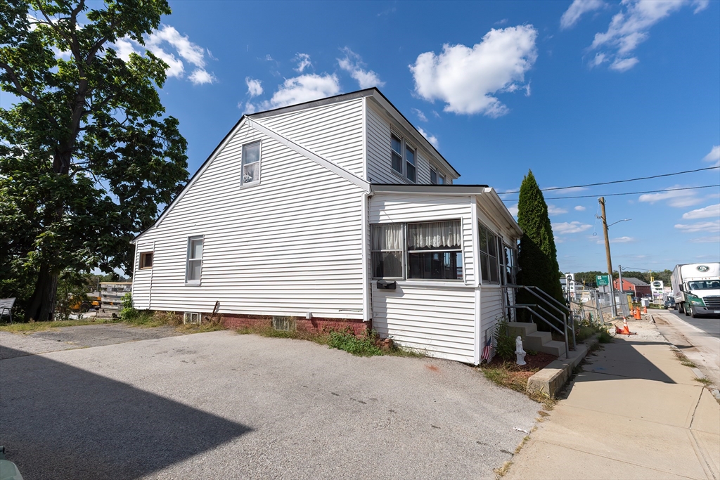 8 Thompson Road Webster, MA 01570 - Photo 3 of 24 a view of a house with a patio