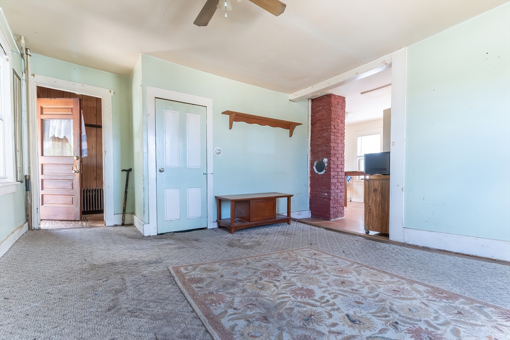 8 Thompson Road Webster, MA 01570 - Photo 5 of 24 an empty room with windows and flowerpot
