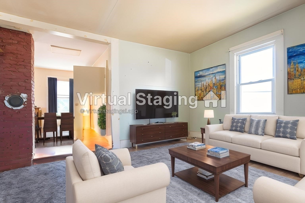 8 Thompson Road Webster, MA 01570 - Photo 8 of 24 a living room with furniture and a flat screen tv