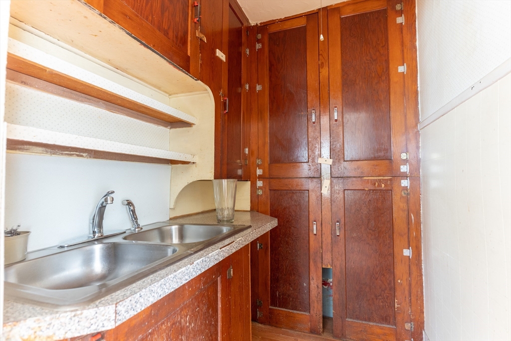 8 Thompson Road Webster, MA 01570 - Photo 9 of 24 a kitchen with sink a refrigerator and cabinets