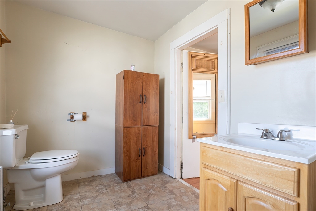 8 Thompson Road Webster, MA 01570 - Photo 10 of 24 a bathroom with a toilet sink and a mirror