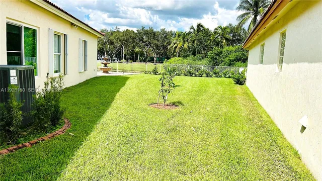 a view of a lake with a big yard