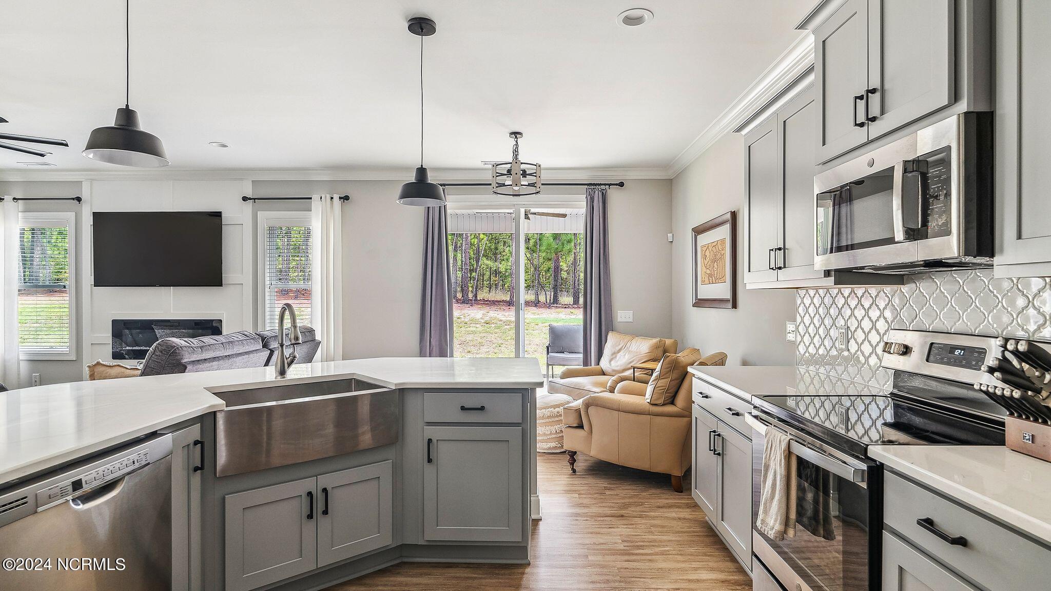 farm sink and stainless appliances