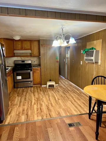 a kitchen with a sink stove and refrigerator
