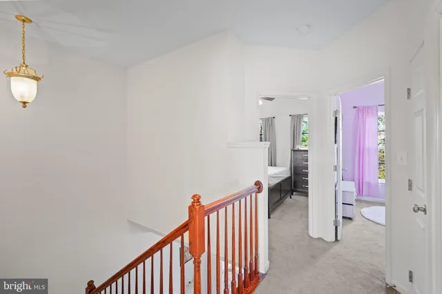 a view of a hallway with entryway door