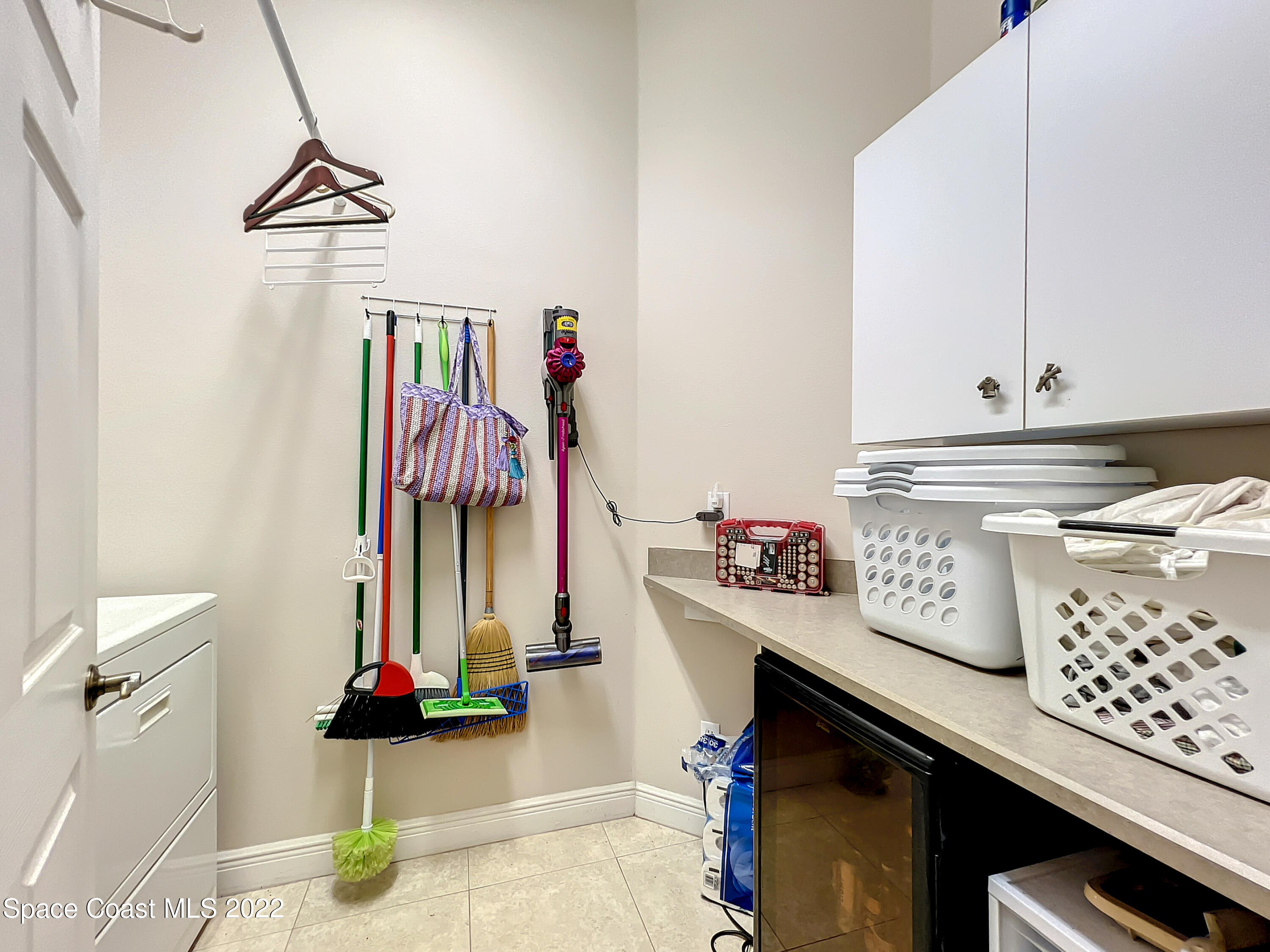 1705 Winding Ridge Circle Southeast Palm Bay, FL 32909 - Photo 24 of 45 a view of a kitchen with appliances and cabinets