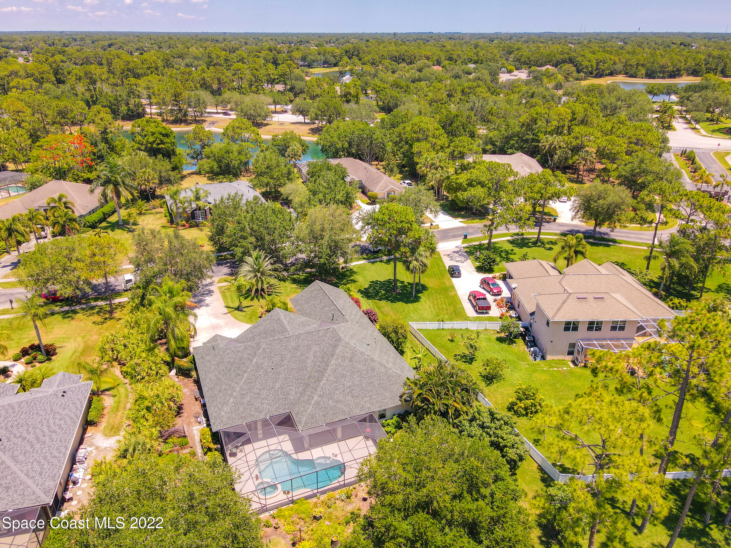 1705 Winding Ridge Circle Southeast Palm Bay, FL 32909 - Photo 41 of 45 an aerial view of residential houses with outdoor space and trees
