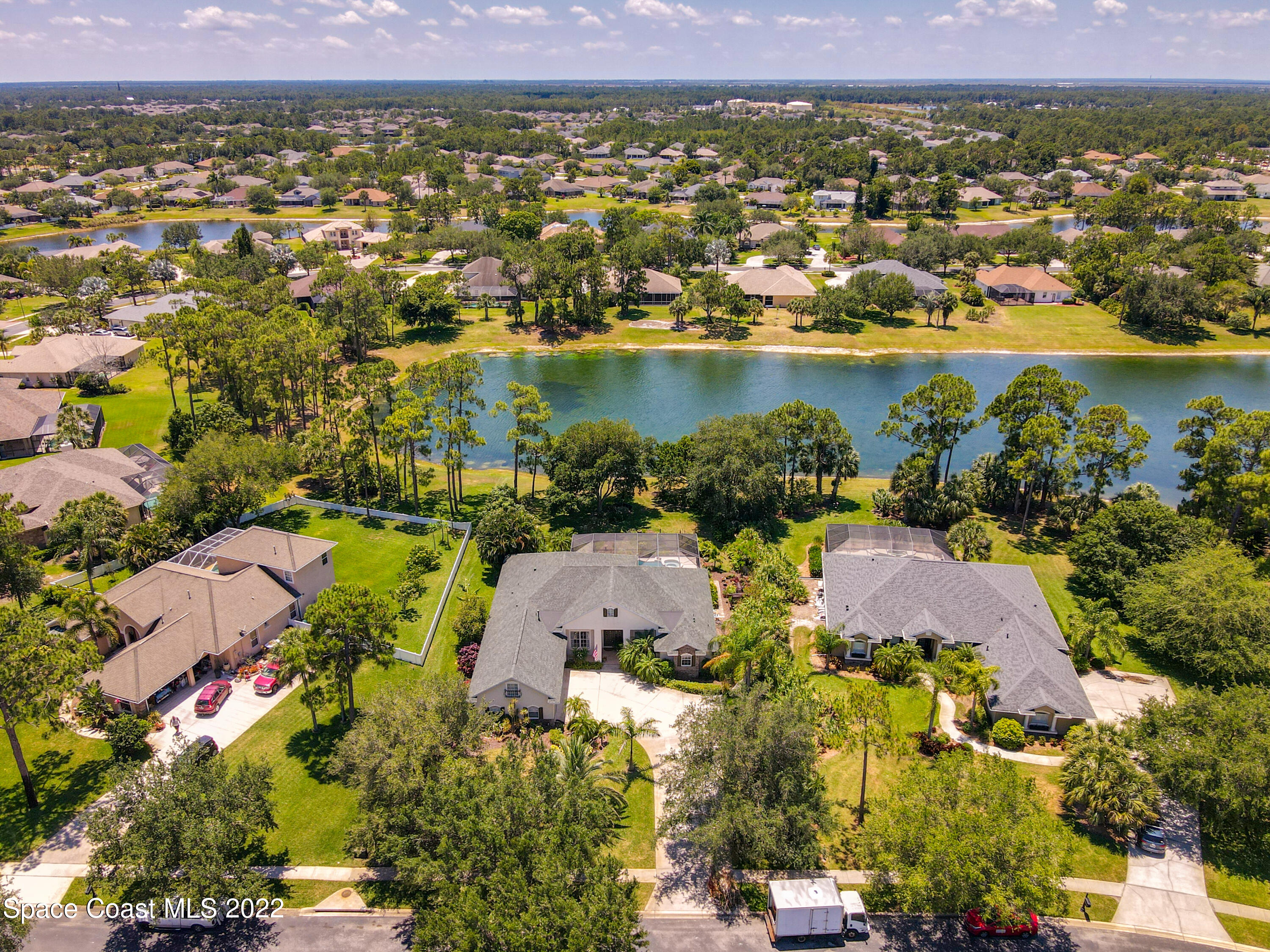 1705 Winding Ridge Circle Southeast Palm Bay, FL 32909 - Photo 42 of 45 an aerial view of residential houses with outdoor space