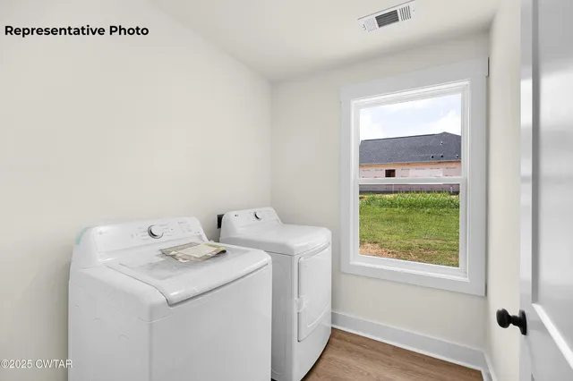 a view of a big room with closet and chandelier fan