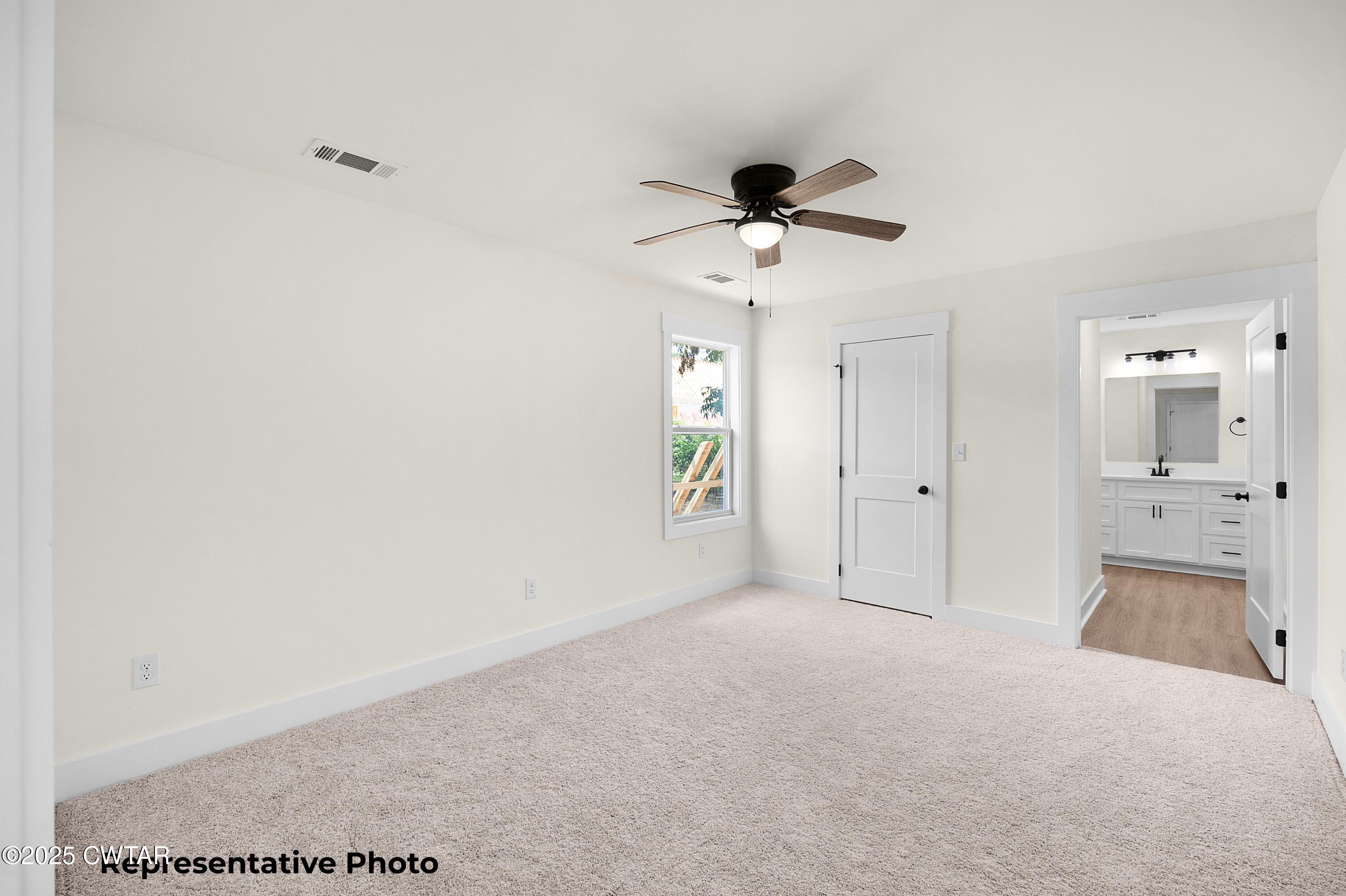 161 West Grand Street Jackson, TN 38301 - Photo 13 of 17 a view of a big room with closet and chandelier fan