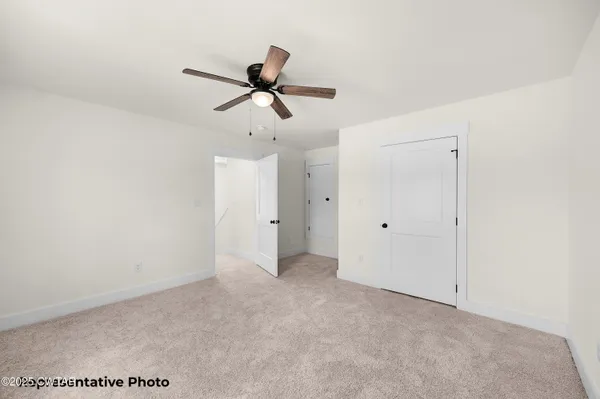 a view of a big room with carpet