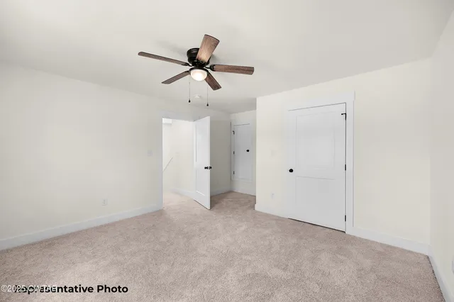 a view of a big room with carpet
