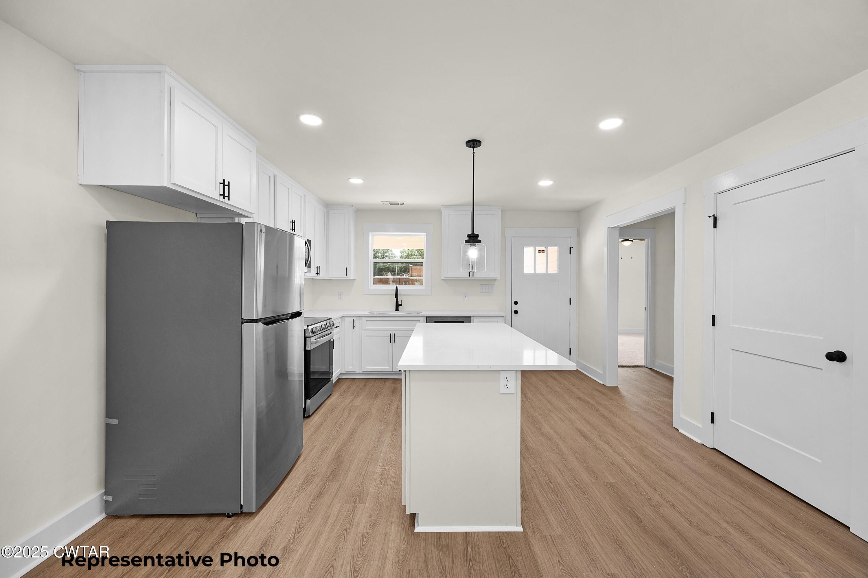 161 West Grand Street Jackson, TN 38301 - Photo 6 of 17 a large kitchen with a lot of counter space and refrigerator