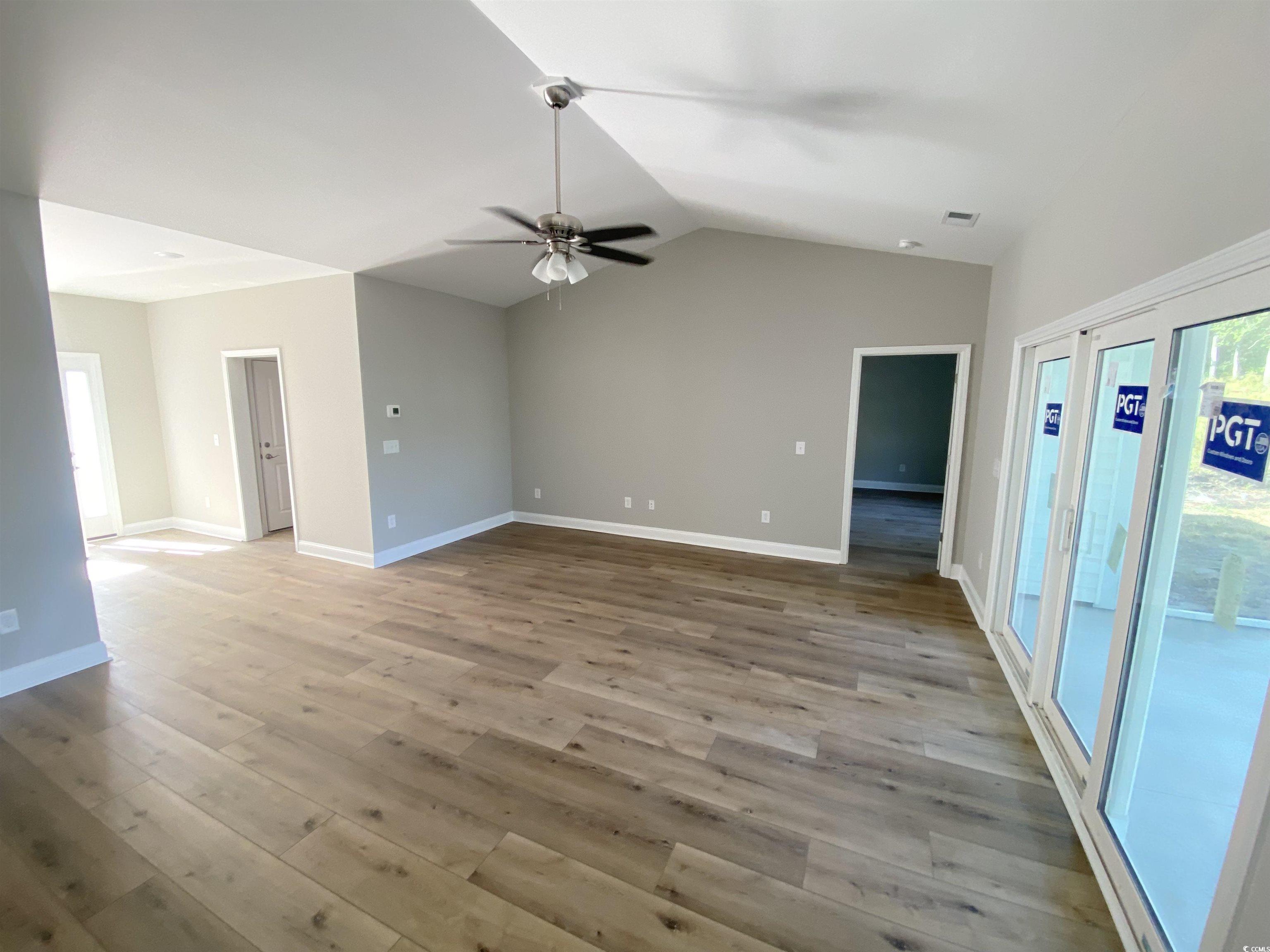 348 Jay Street Murrells Inlet, SC 29576 - Photo 12 of 29 Spare room featuring lofted ceiling, light wood-ty
