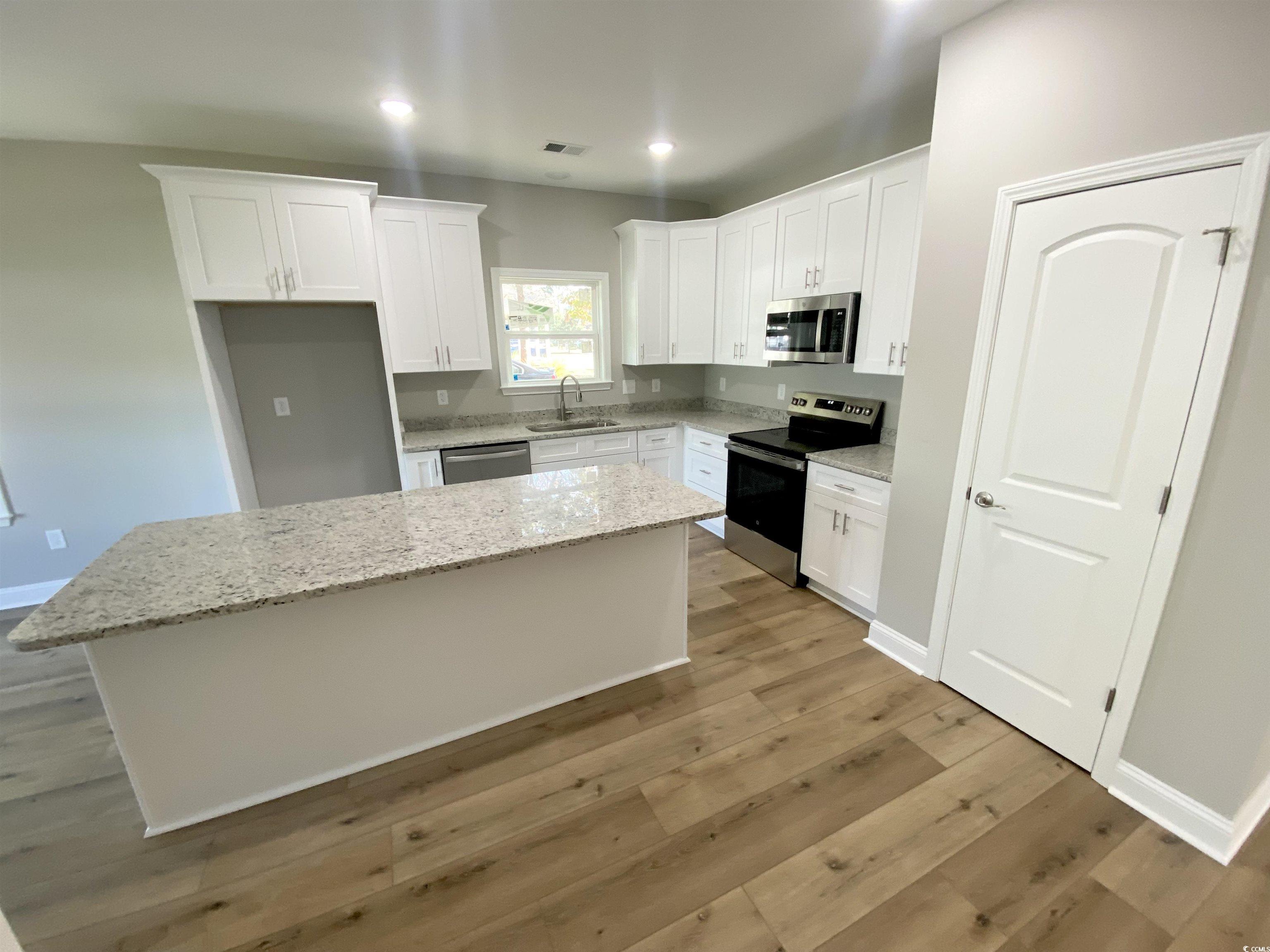 348 Jay Street Murrells Inlet, SC 29576 - Photo 2 of 29 Kitchen featuring a center island, appliances with