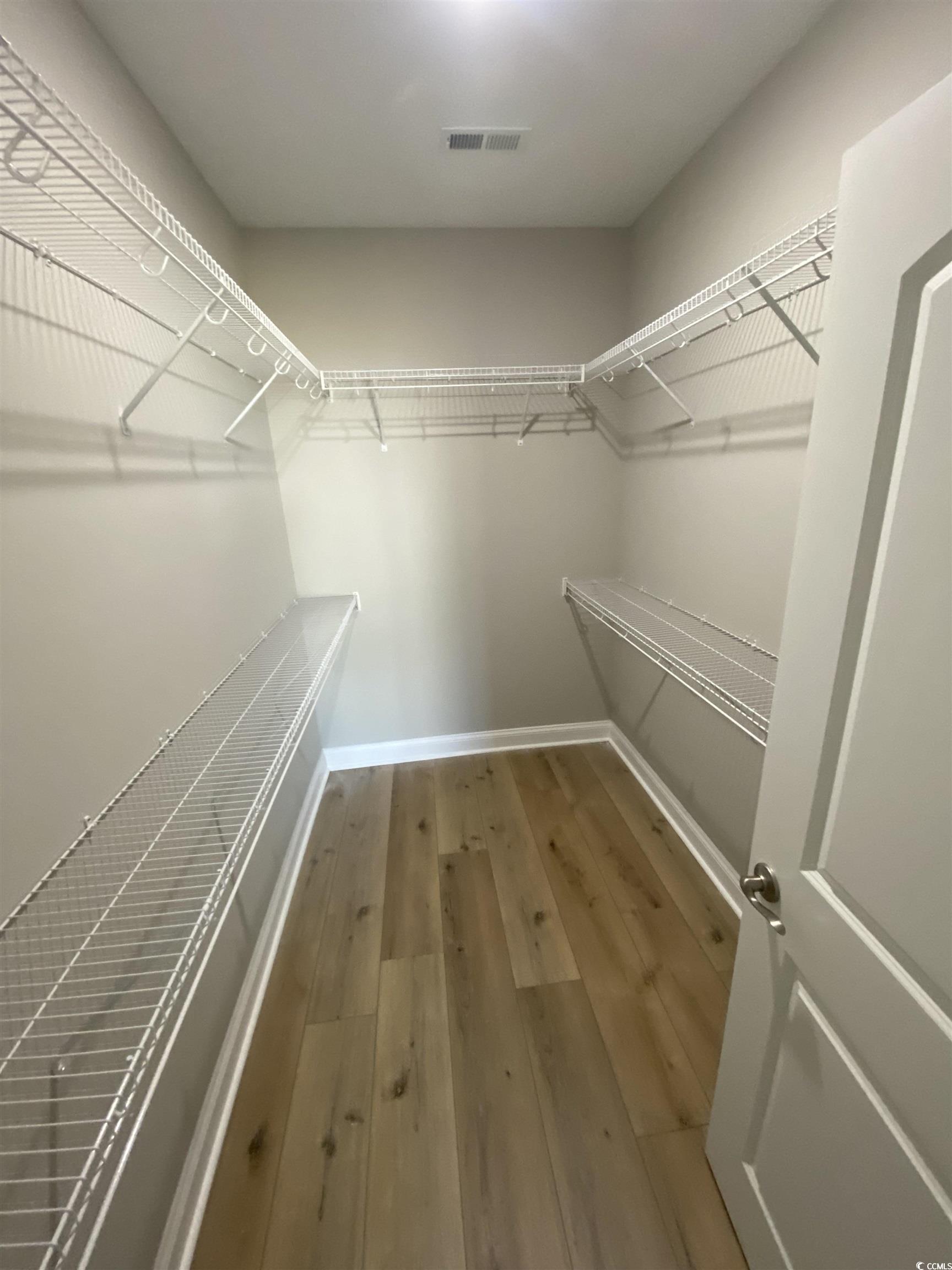 348 Jay Street Murrells Inlet, SC 29576 - Photo 21 of 29 Spacious closet featuring hardwood / wood-style fl