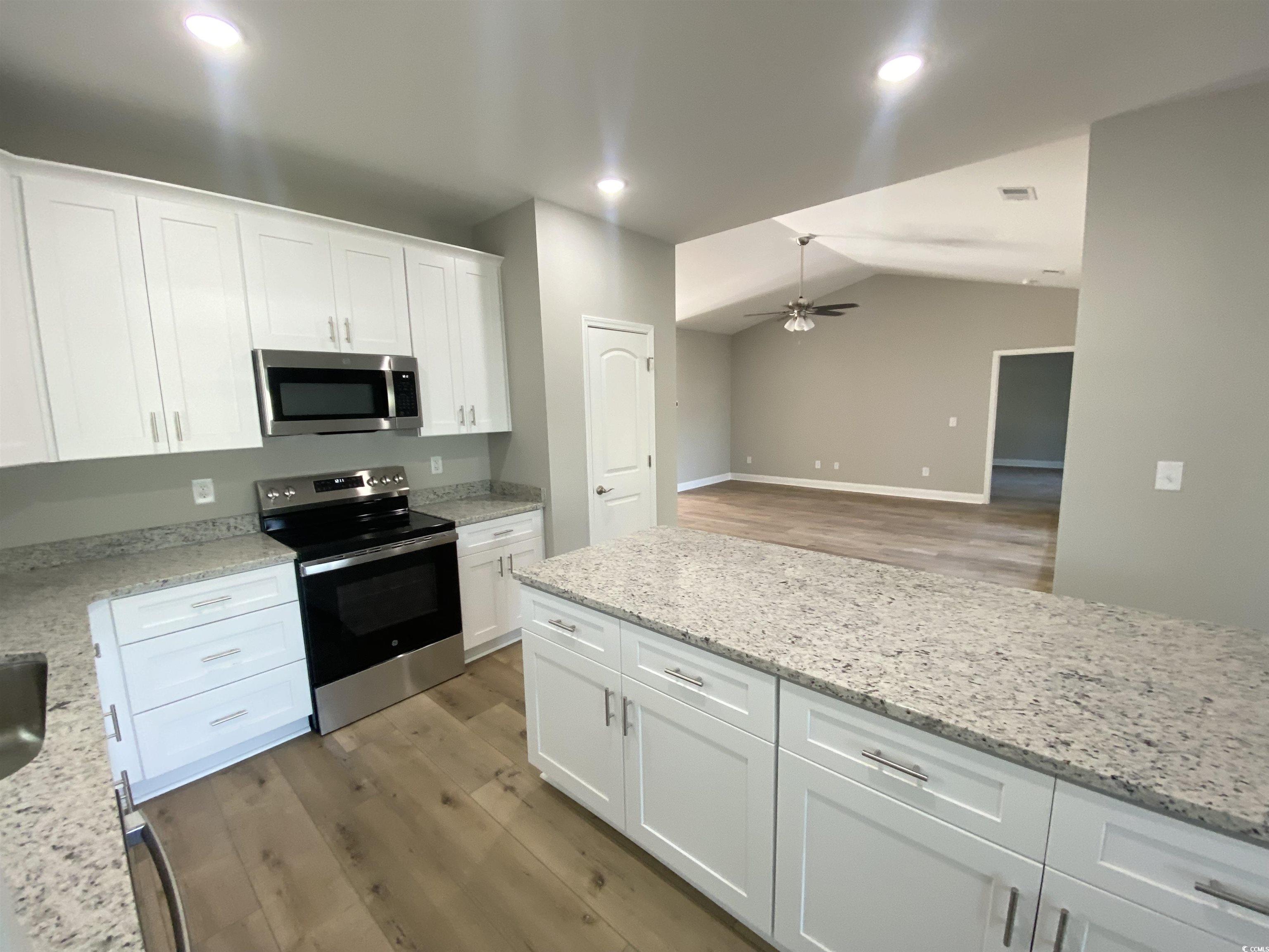 348 Jay Street Murrells Inlet, SC 29576 - Photo 5 of 29 Kitchen featuring white cabinetry, ceiling fan, st