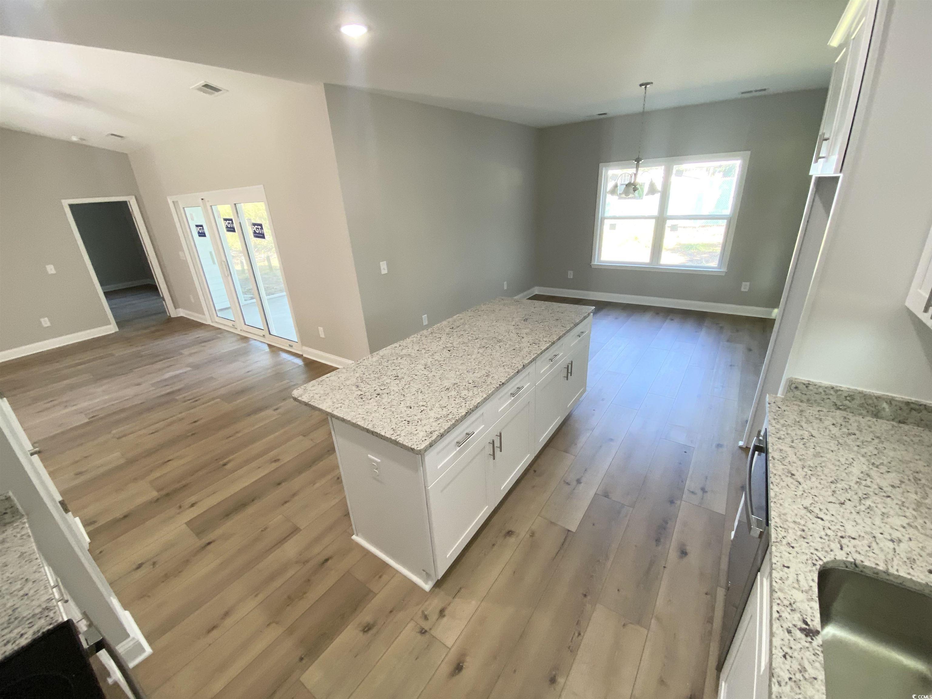 348 Jay Street Murrells Inlet, SC 29576 - Photo 6 of 29 Kitchen featuring light stone counters, a center i