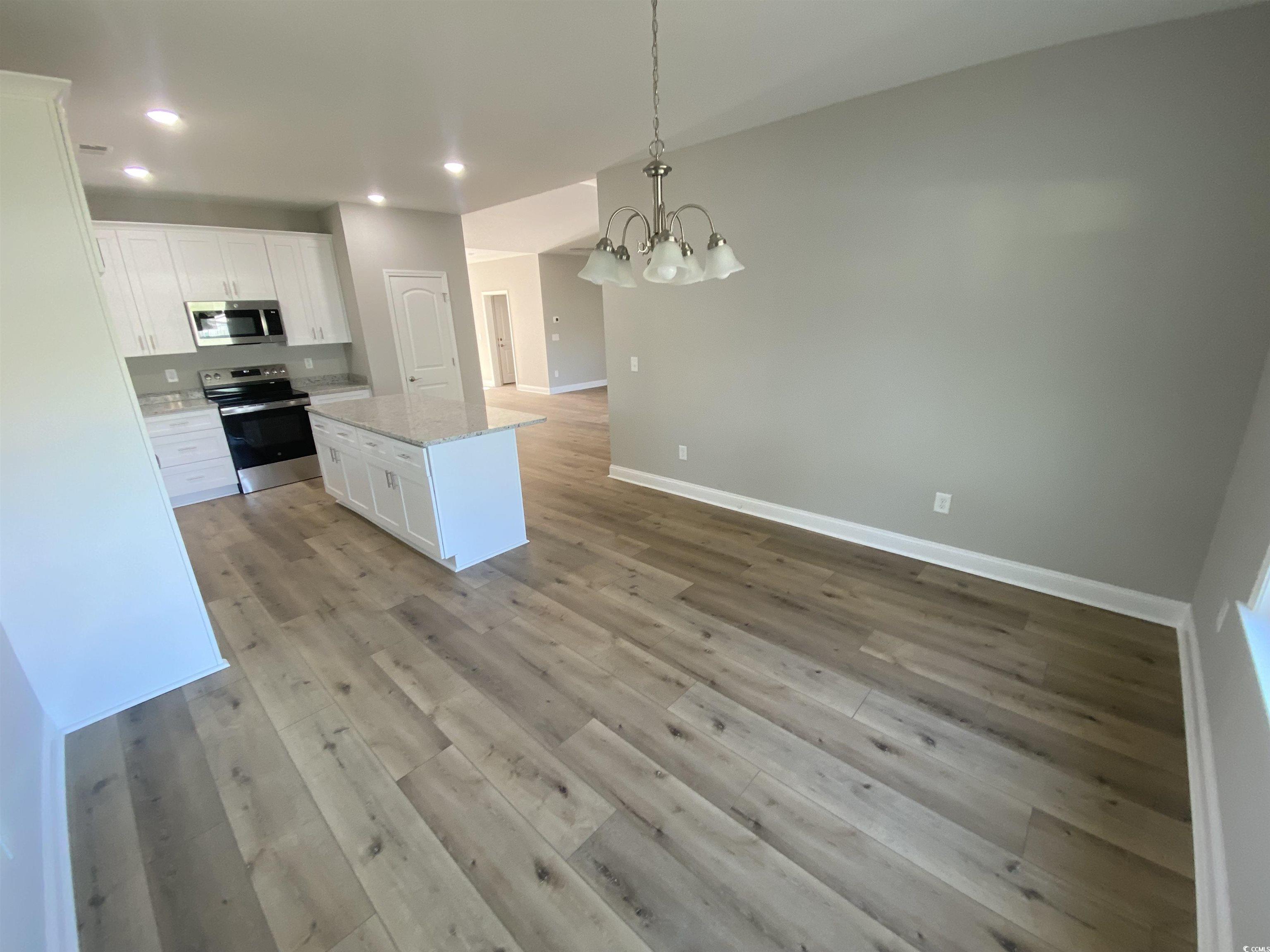 348 Jay Street Murrells Inlet, SC 29576 - Photo 7 of 29 Kitchen featuring a center island, pendant lightin