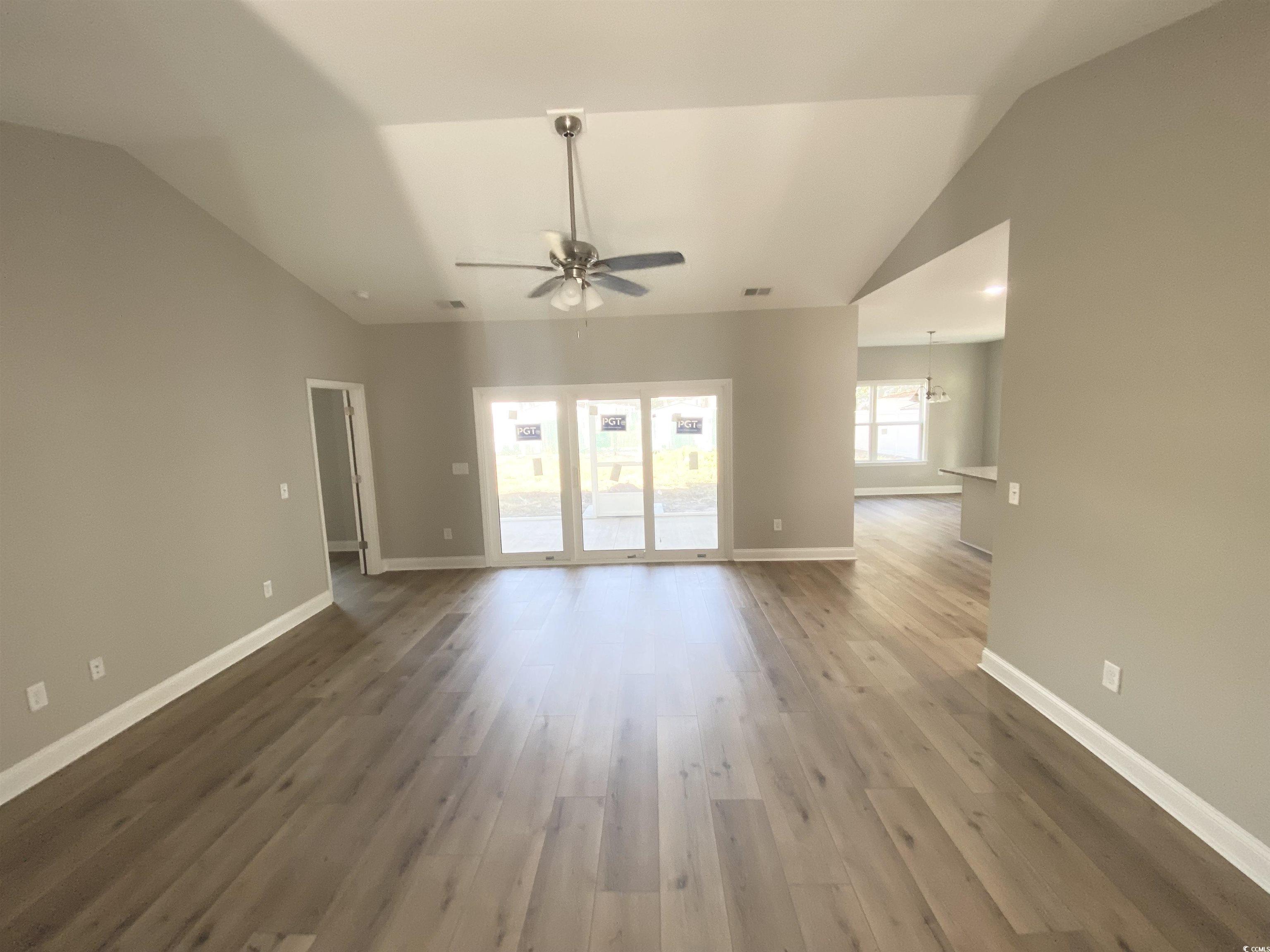 348 Jay Street Murrells Inlet, SC 29576 - Photo 9 of 29 Unfurnished living room with wood-type flooring, c
