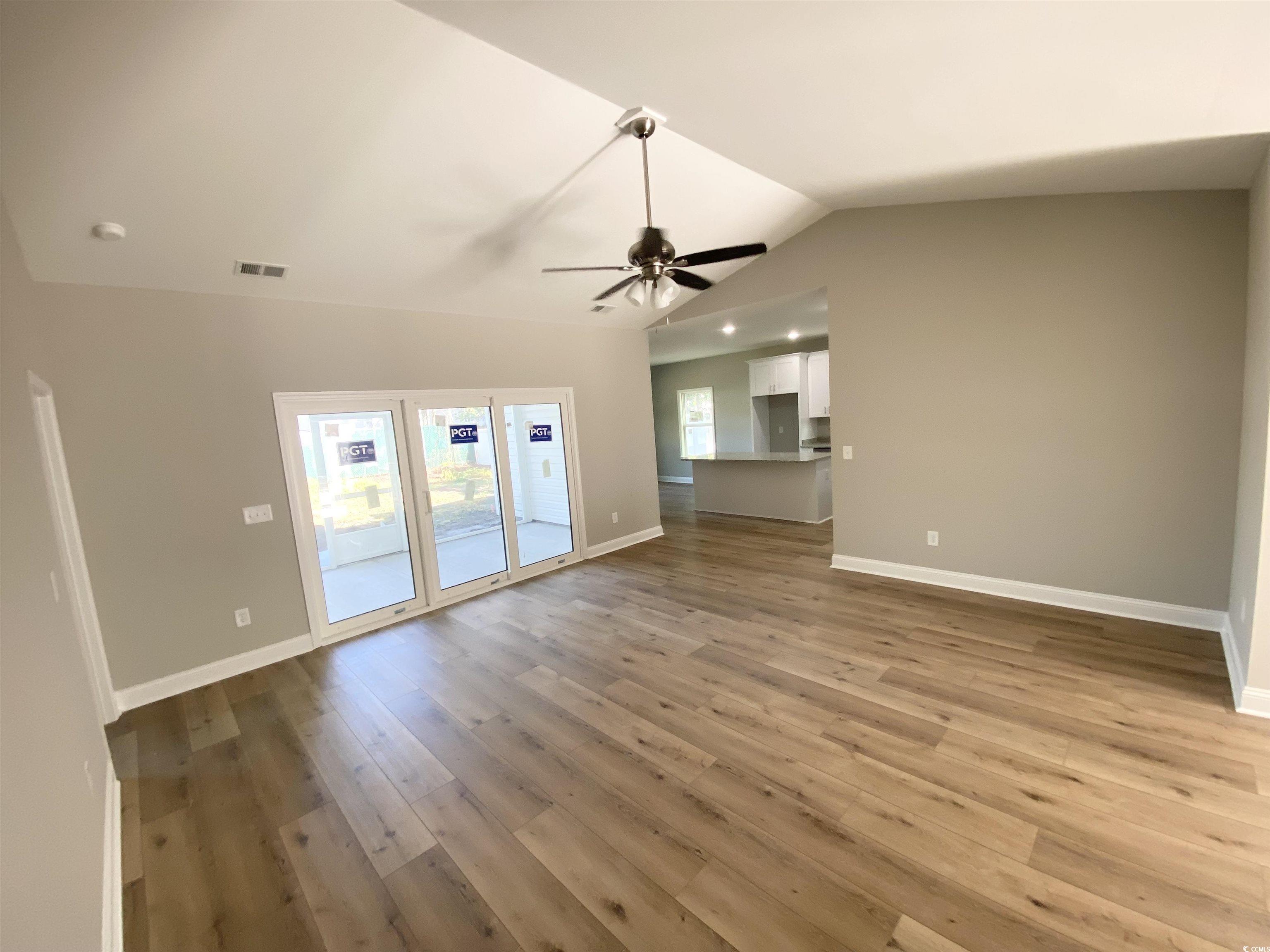 348 Jay Street Murrells Inlet, SC 29576 - Photo 10 of 29 Unfurnished living room with lofted ceiling, light