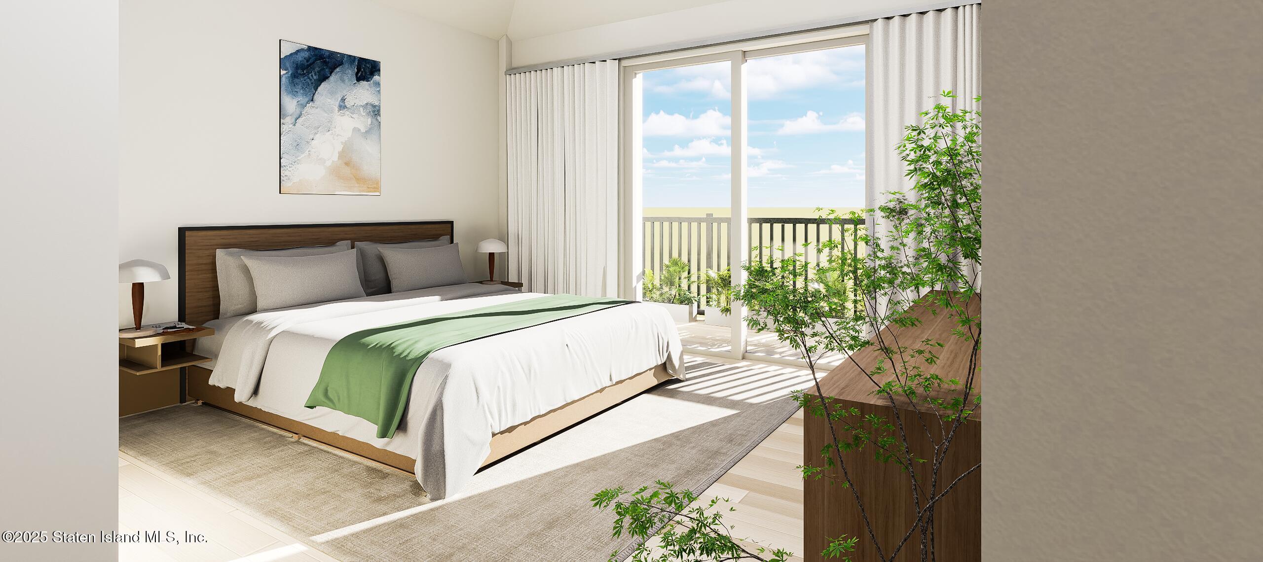 1239 Forest Hill Road, Unit 5 Staten Island, NY 10314 - Photo 11 of 15 a bed sitting in a bedroom next to a window