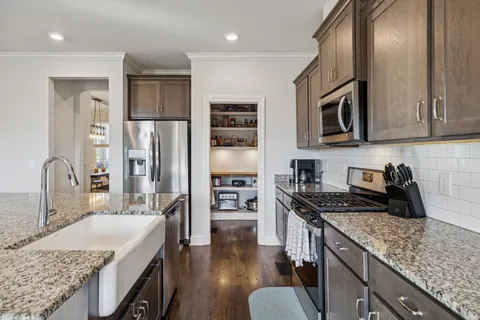 a bedroom with a bed and a table