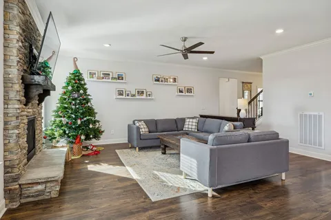 a kitchen with stainless steel appliances granite countertop a sink stove and wooden floor