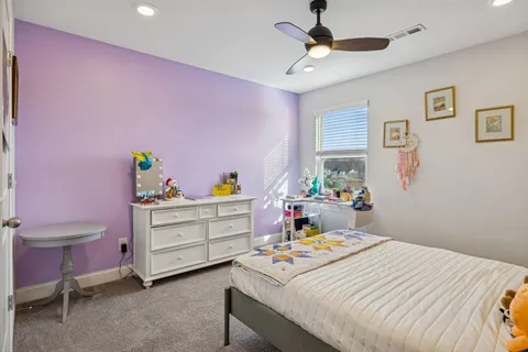 a bedroom with a bed and a desk