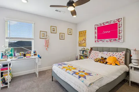 a bedroom with a bed and window