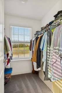 a view of a patio with a table and chairs