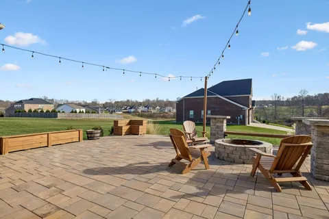 a view of a lake with a garden and houses