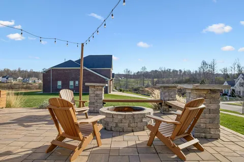 an aerial view of a house with a lake view