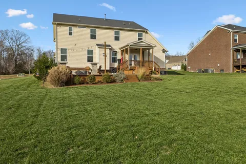 an aerial view of a house with a garden