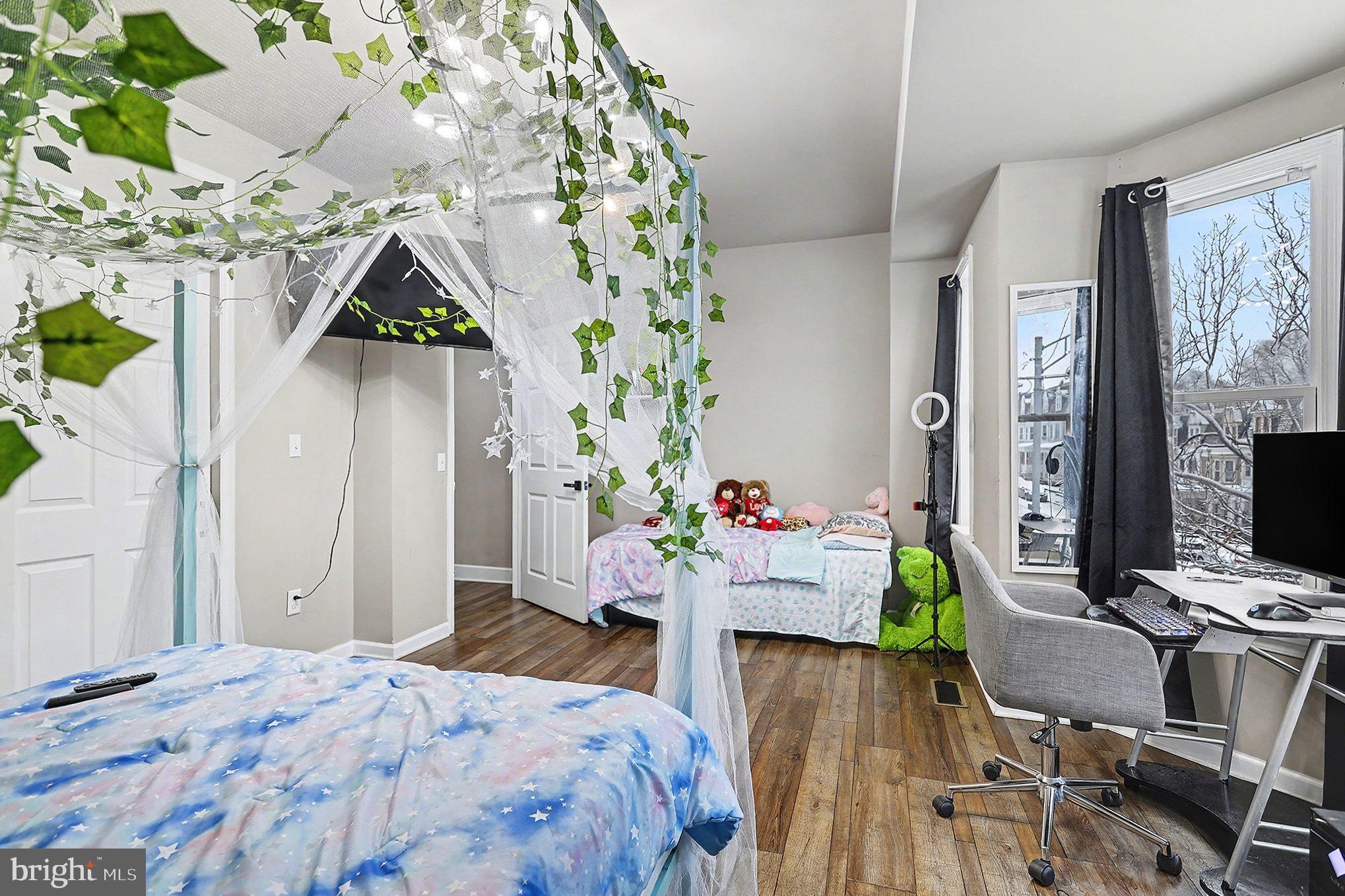 669 West Princess Street York, PA 17401 - Photo 18 of 33 a bedroom that has a bed and a chair in it