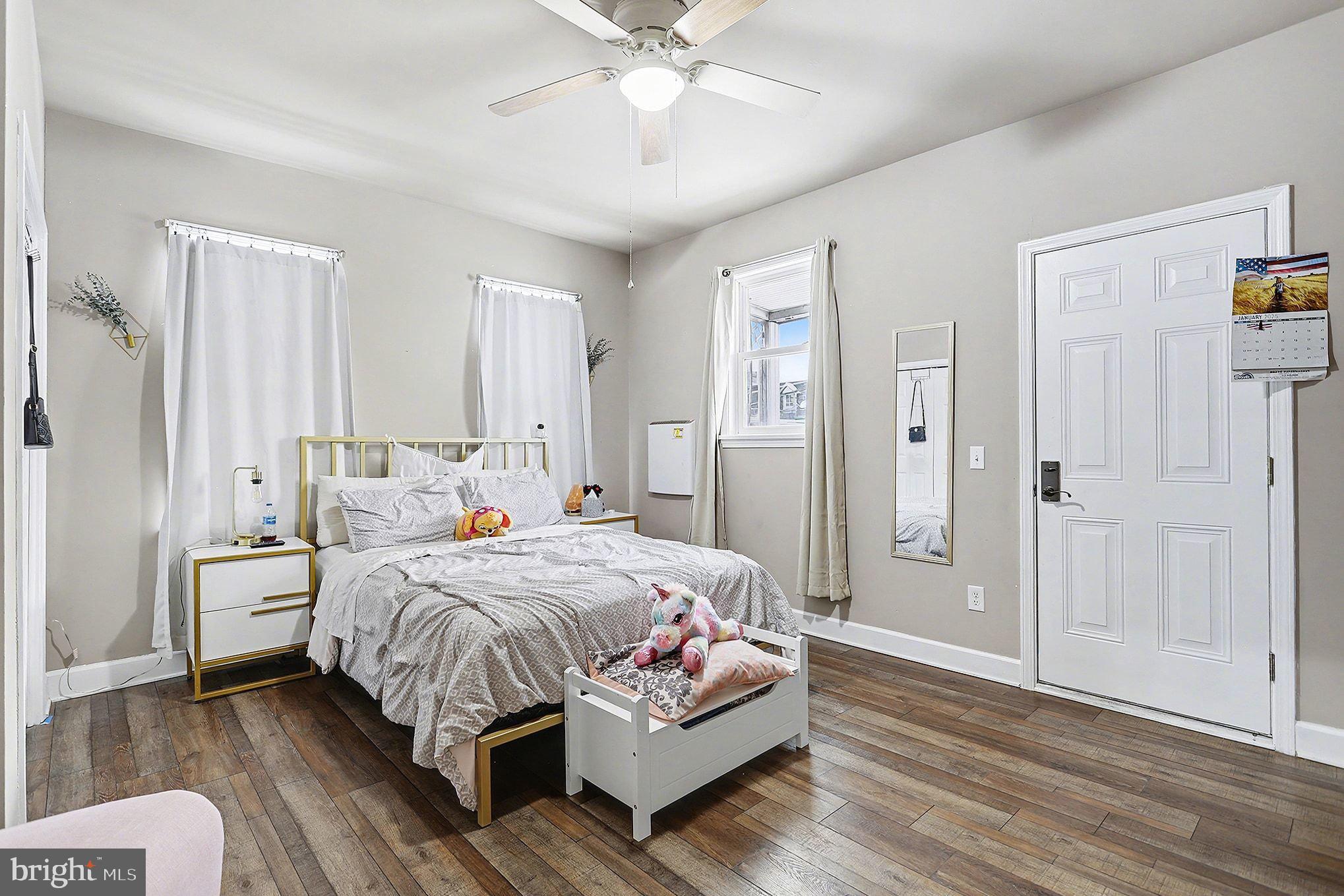 669 West Princess Street York, PA 17401 - Photo 19 of 33 a bedroom with a bed and a chandelier