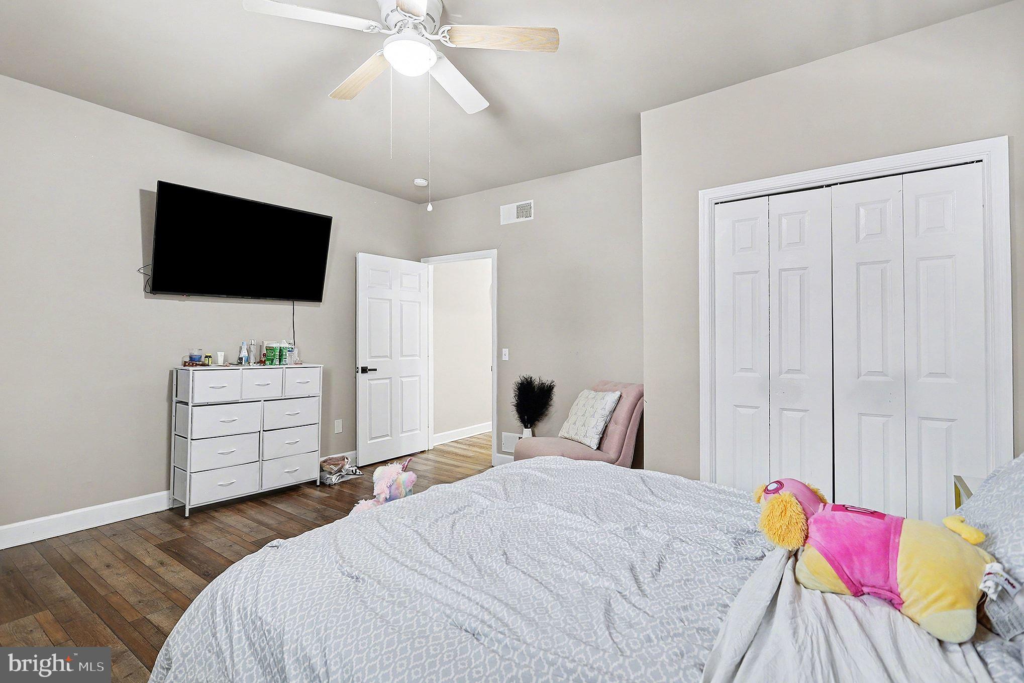 669 West Princess Street York, PA 17401 - Photo 20 of 33 a bedroom with a bed and a flat screen tv