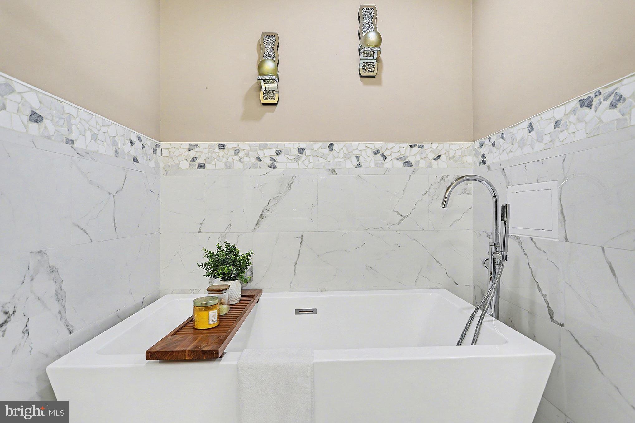 669 West Princess Street York, PA 17401 - Photo 22 of 33 a bathroom with a bathtub and a shower