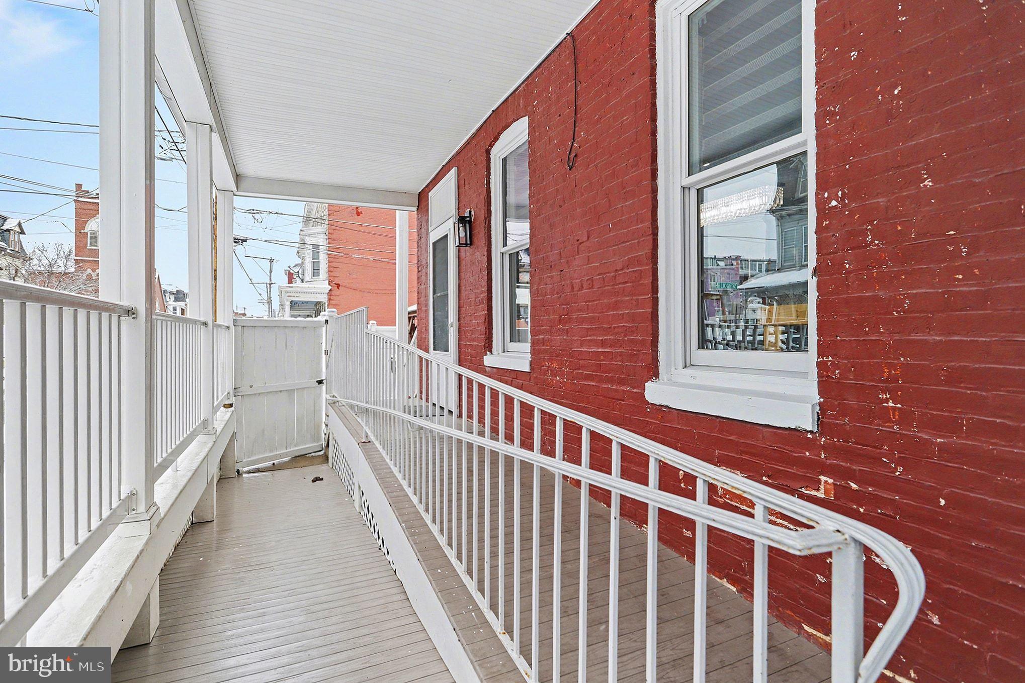 669 West Princess Street York, PA 17401 - Photo 23 of 33 a view of a balcony with wooden floor and fence