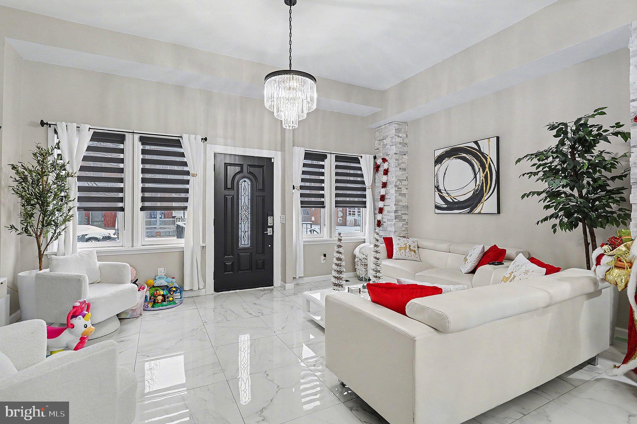 669 West Princess Street York, PA 17401 - Photo 3 of 33 a living room with furniture and a chandelier
