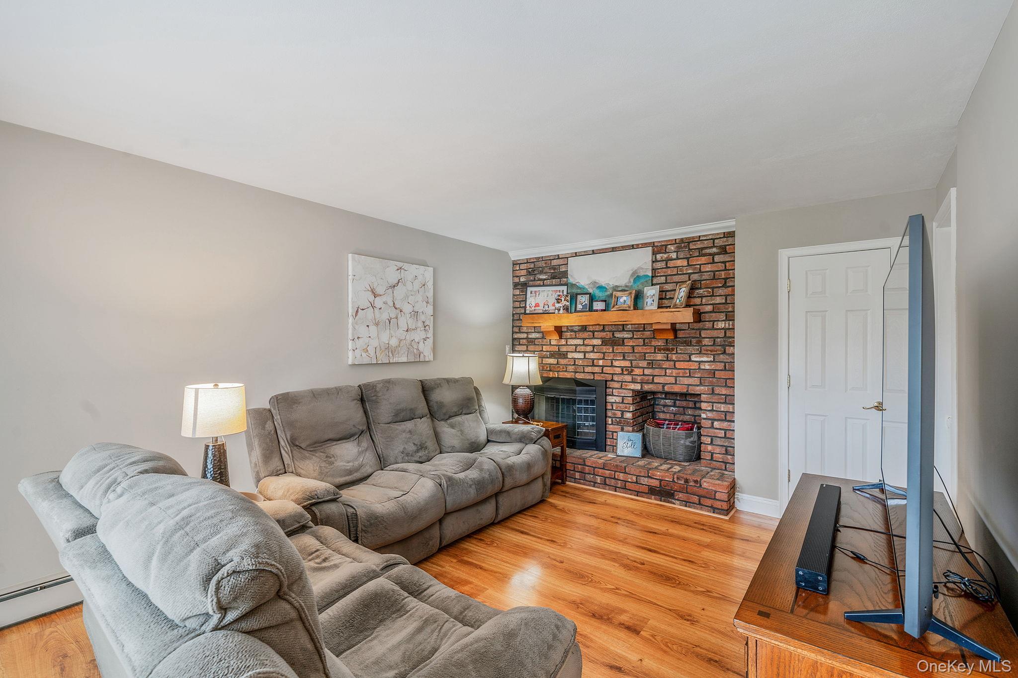 3 Meroke Lane Rocky Point, NY 11778 - Photo 13 of 43 Wood burning fireplace, closet