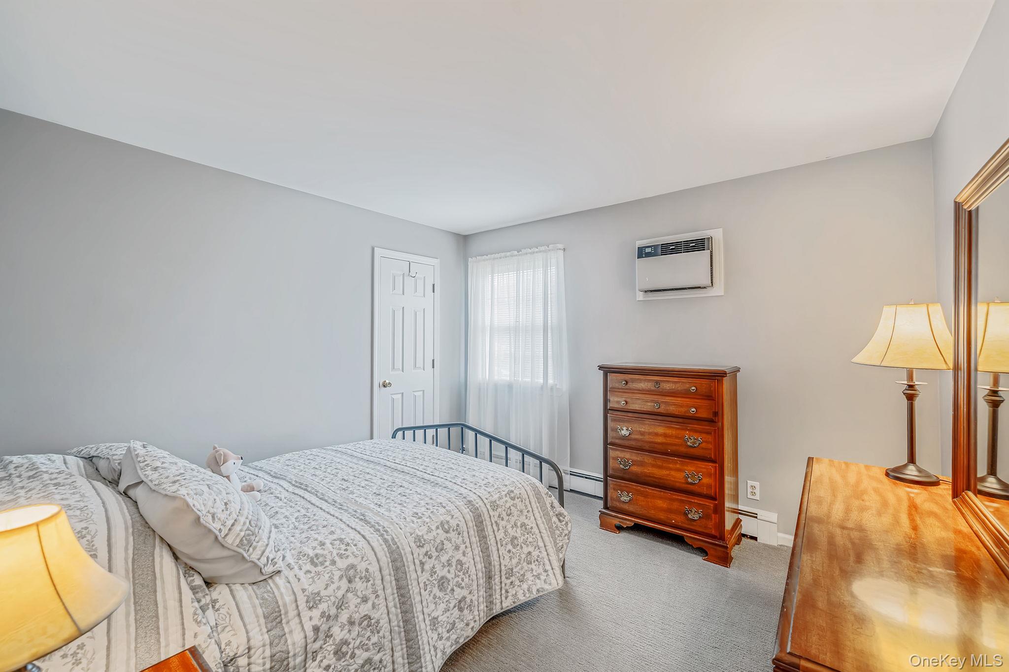 3 Meroke Lane Rocky Point, NY 11778 - Photo 24 of 43 Bedroom 4 - with walk-in closet, built-in a/c unit, newer carpet