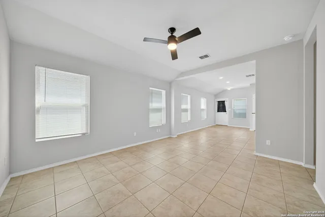 a view of an empty room with a window