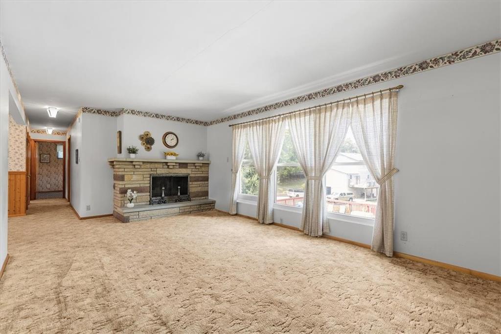 1891 Concord Drive Ambridge, PA 15003 - Photo 11 of 40 an empty room with furniture and a fireplace