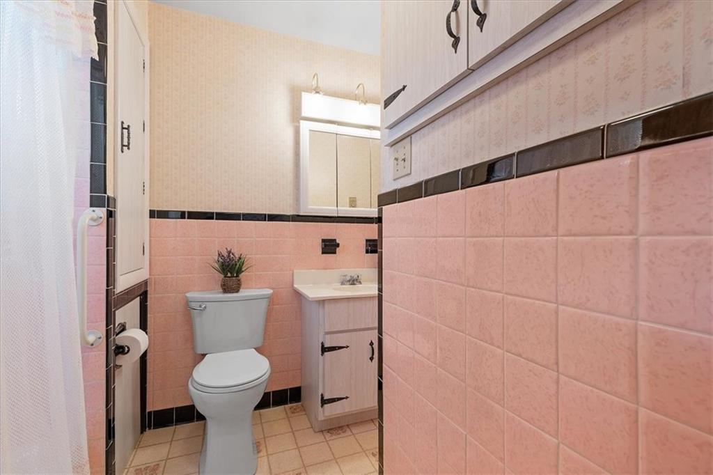 1891 Concord Drive Ambridge, PA 15003 - Photo 19 of 40 a white toilet sitting next to a bathroom sink