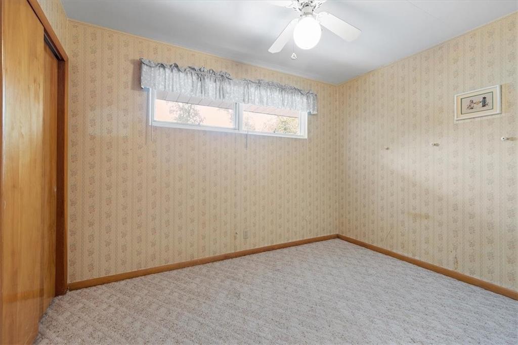 1891 Concord Drive Ambridge, PA 15003 - Photo 20 of 40 an empty room with windows and chandelier fan