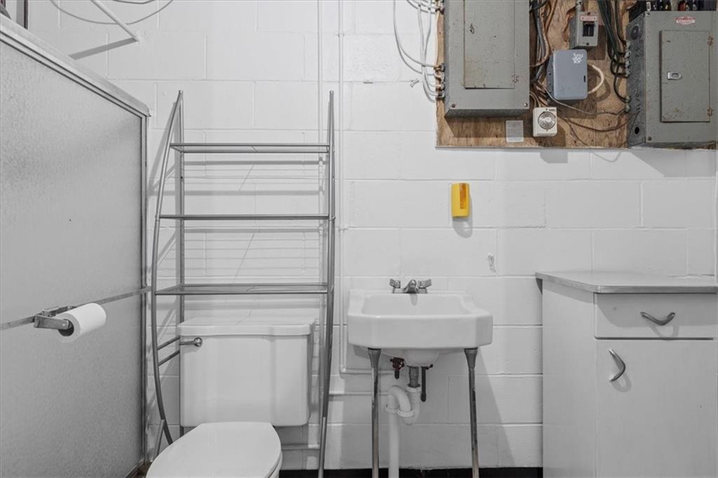 1891 Concord Drive Ambridge, PA 15003 - Photo 28 of 40 a bathroom with a toilet sink and shower